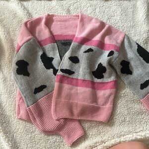 Pink cow print sweater